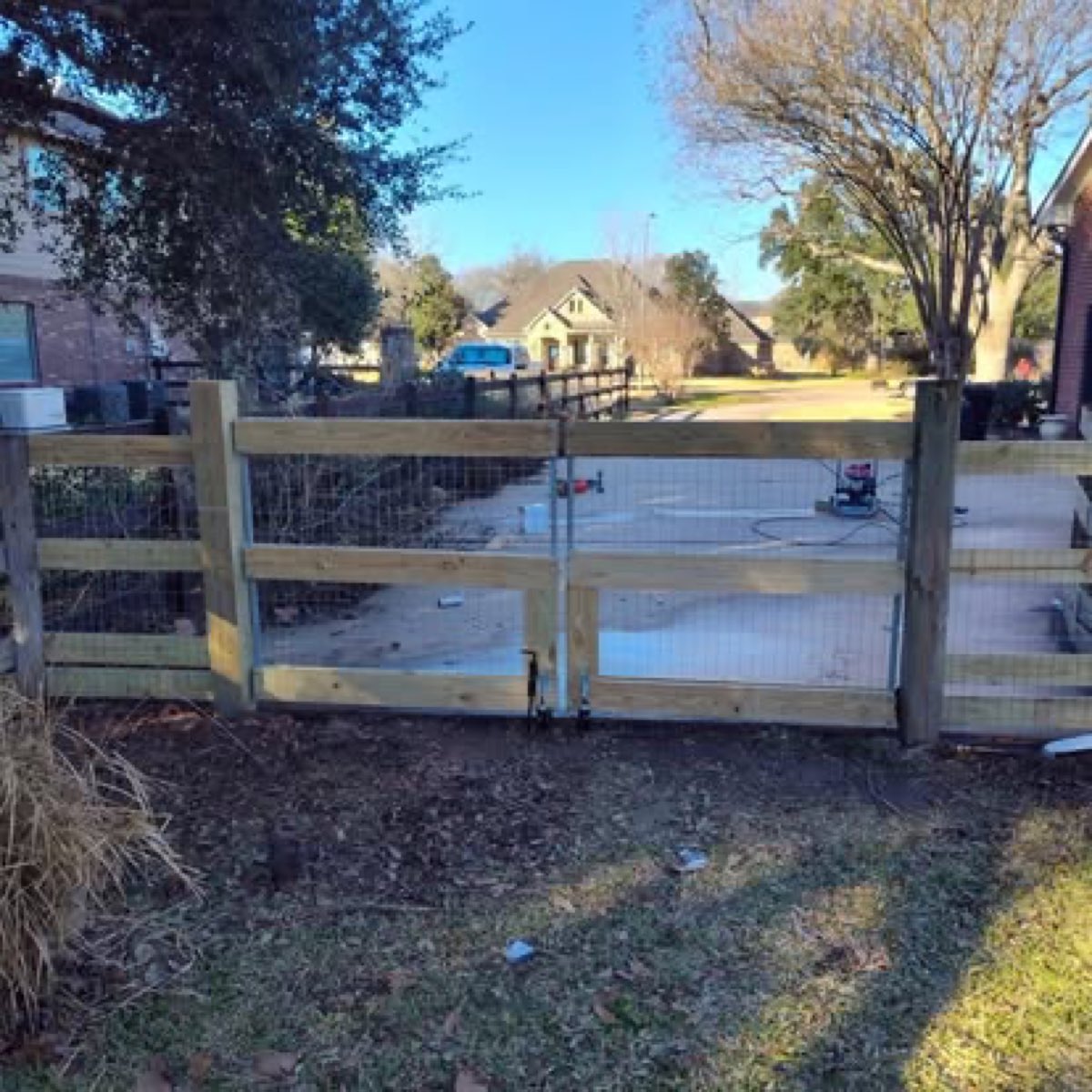 Custom ranch-style wood and wire gate